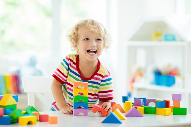 Kid,Playing,With,Colorful,Toy,Blocks.,Little,Boy,Building,Tower