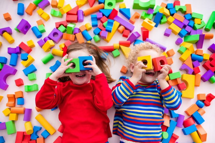 Happy,Preschool,Age,Children,Play,With,Colorful,Plastic,Toy,Blocks.